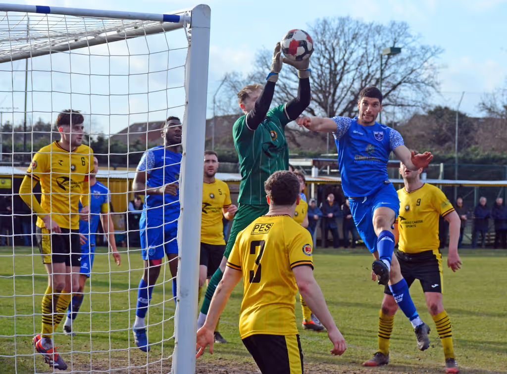 Stanway Rovers keeper Callum Robinson claims this corner